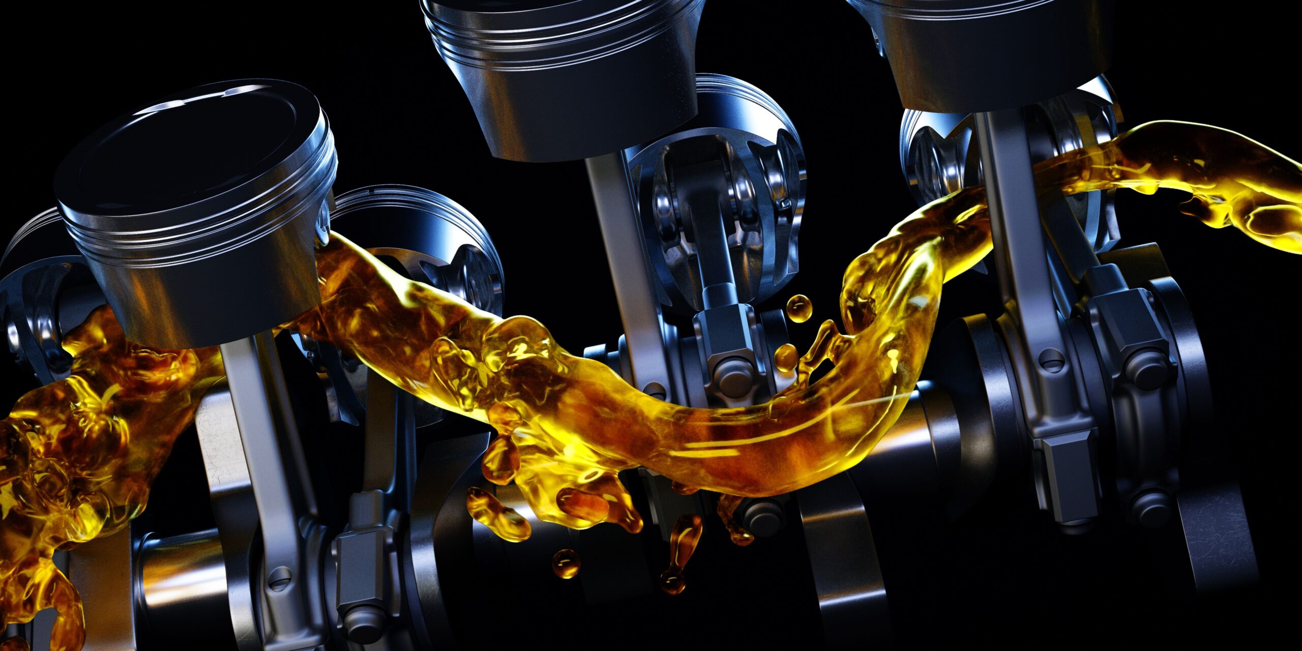 Engine pistons and connecting rods illuminated by the golden glow of flowing motor oil.